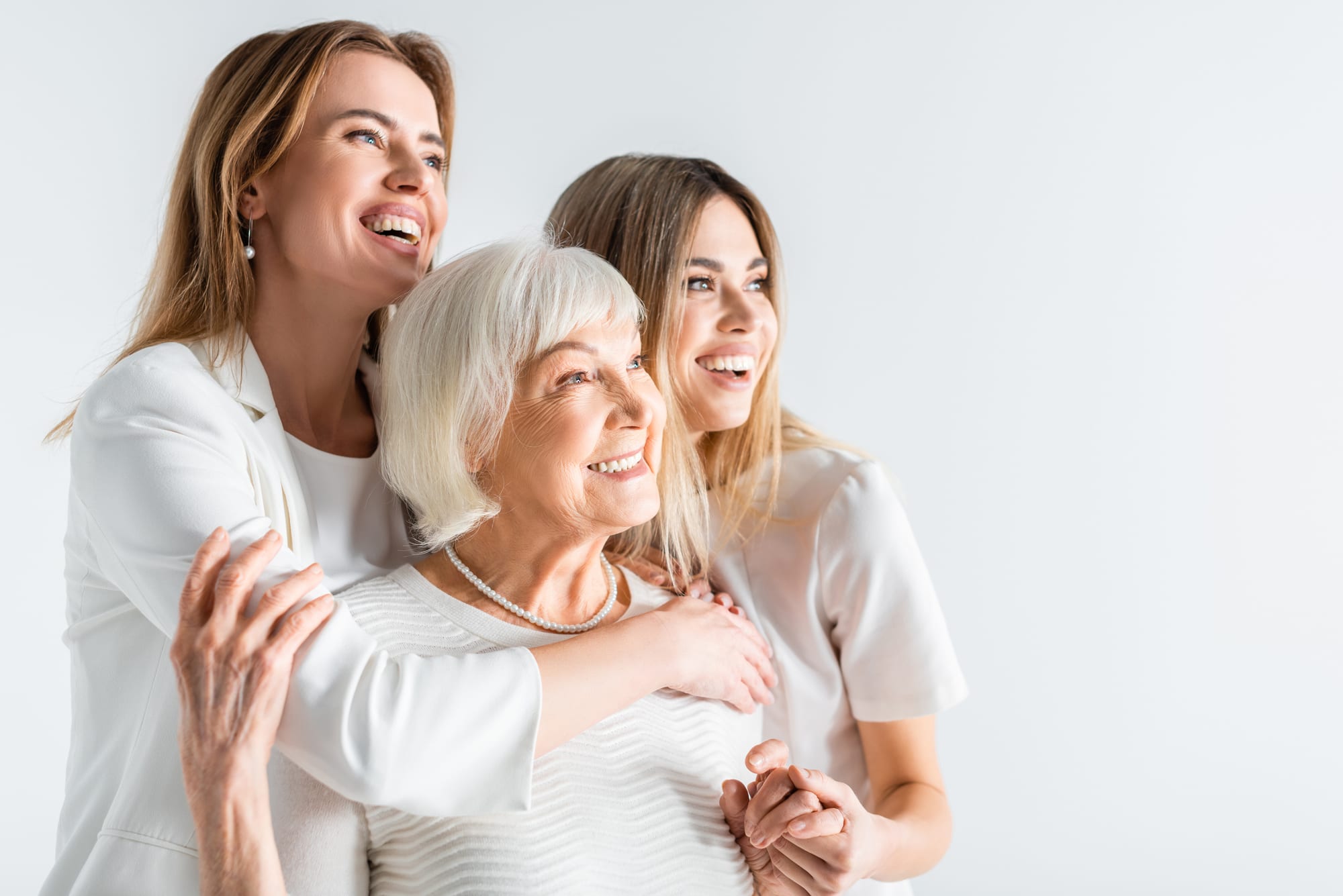 Three generations of women smiling together